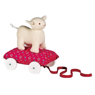 Mouton �cru sur coussin � roulettes fuchsia (24 cm) par Trousselier