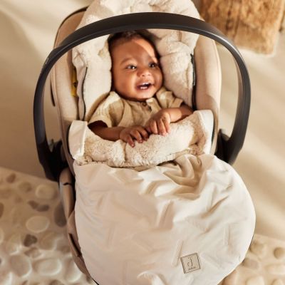 Nid d'ange passe sangle Embossed Sand (groupe 0+)