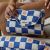 Variation Bleu, écru, orange du produit Tapis à langer Comme un bonbon Romy damier bleu de la marque BEBEL