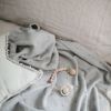 Couverture tricotée en coton bio Pointelle Gray melange (100 x 80 cm)  par Mushie